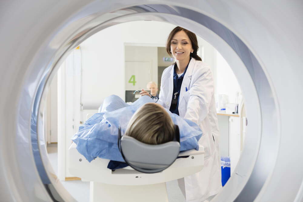A woman getting an MRI scan before uterine fibroid embolization