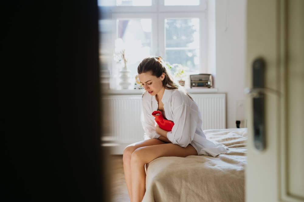 Young woman in severe menstrual pain